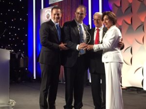 (From left to right) United Hatzalah EMT Gavy Friedson, and Founder and President of United Hatzalah Eli Beer, Present the Hatzalah Champions Award to Elie and Siona Alyeshmerni