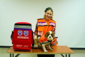 Lucy and hen handler Batya Jaffe are both members of the Psychotrauma Unit