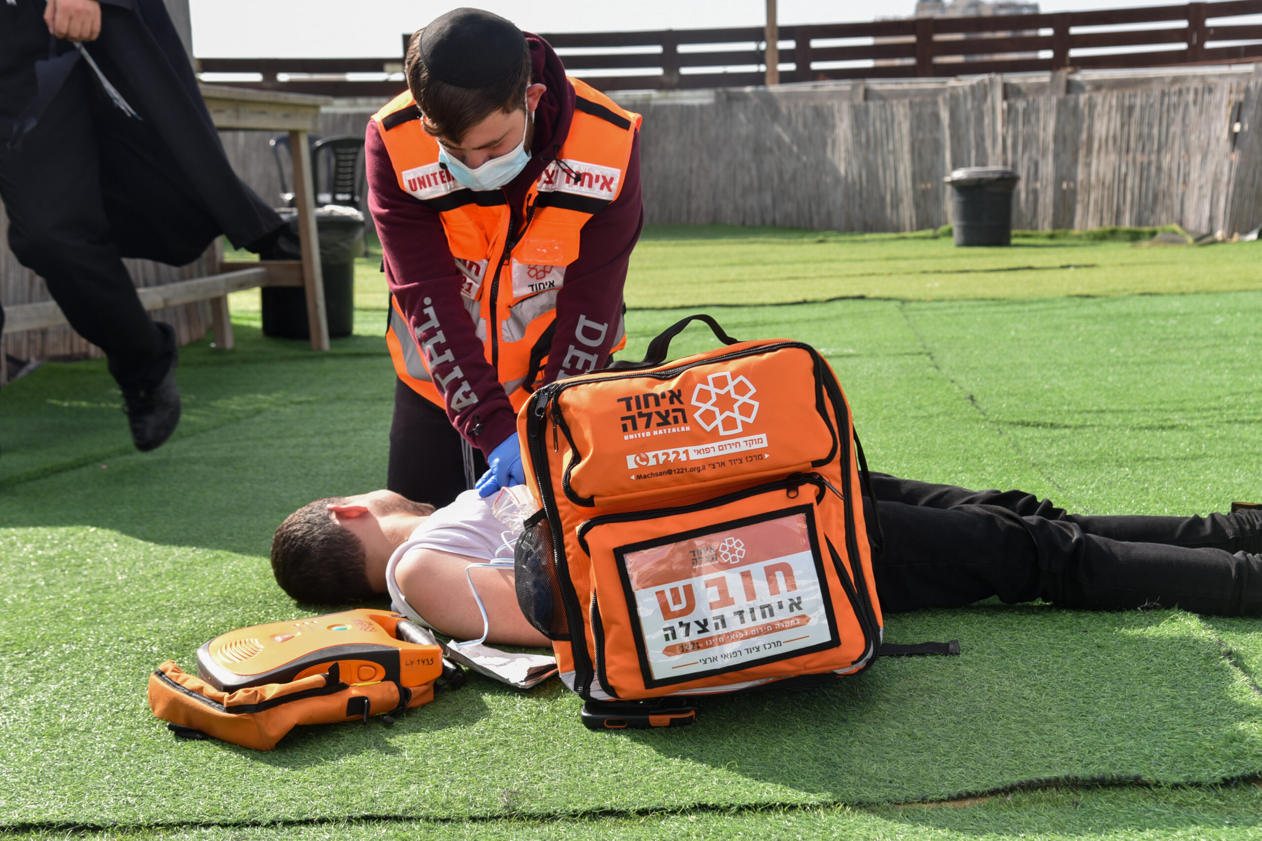 A United Hatzalah volunteer performing CPR on a patient illustration scaled 2