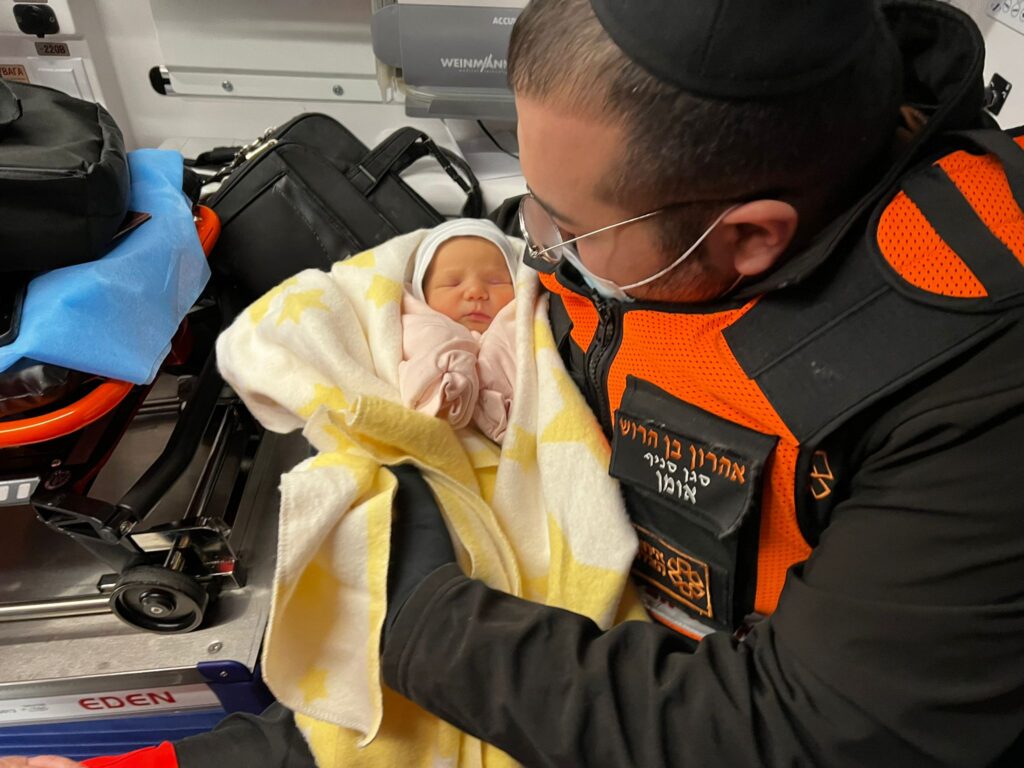 Aharon in an ambulance with the second baby 1024x768 1