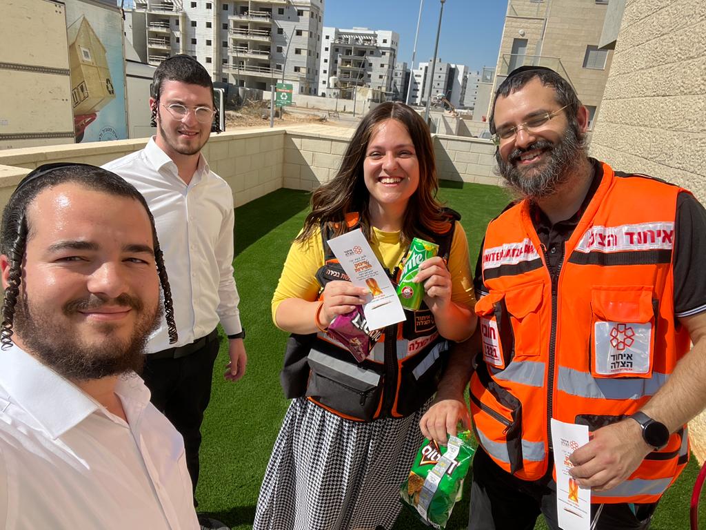Dov Rinkoff with his wife Hila and two other members of United Hatzalah outside their home in Kiryat Gat 1