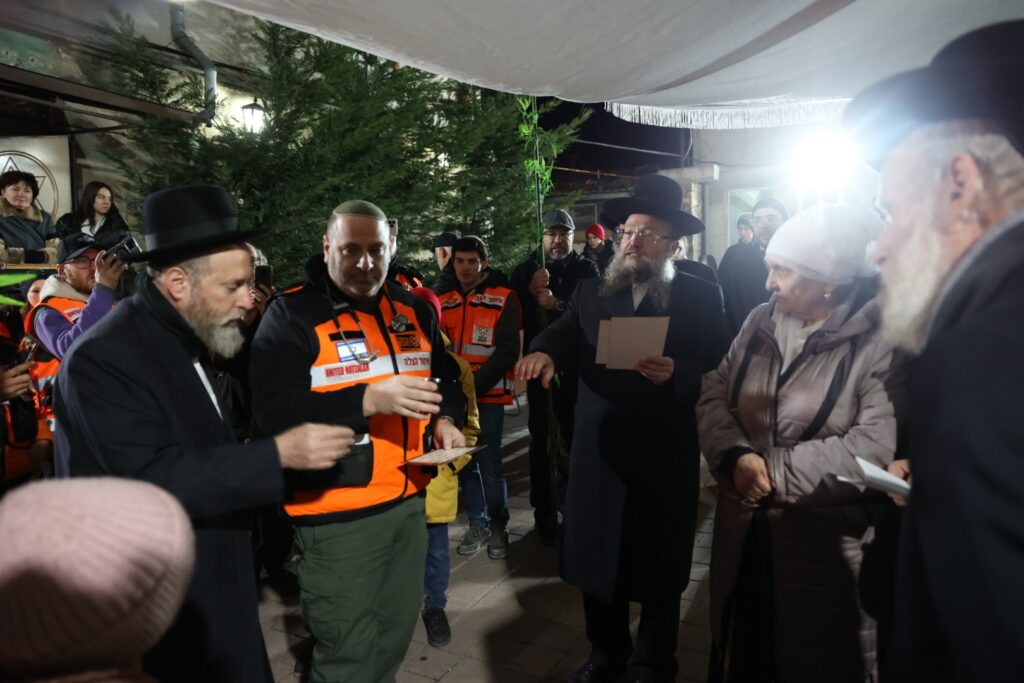 Dr. Zev Neuwirth from Miami reciting one of the blessings during the double wedding of refugees in Kishinev 1024x683 1