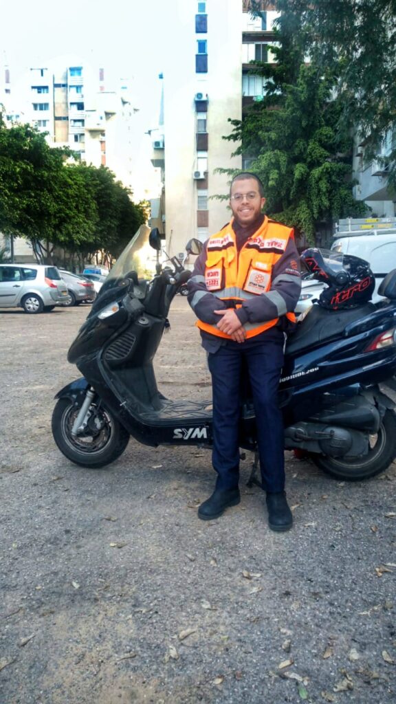 Elon Menachem Chasni and his motorcycle 576x1024 1