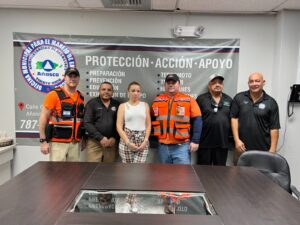 Friedson left and other team members meet with the heads of emergency services in Anasco to coordinate relief efforts 300x225 1