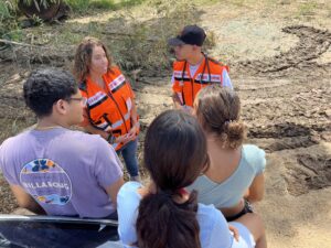 Gaby and Luis talking with local residents in Anasco 300x225 1