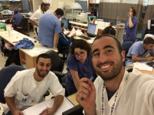 United Hatzalah volunteer medics Gavriel Struck and Shmuel Dahuki take a moment out of helping nurses in Jerusalem's Hadassah Ein Kerem hospital as part of the hospital liaison program.