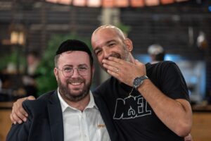 Moshe Ben Yishai standing with Naftali Rotenberg who rescued him 300x200 1