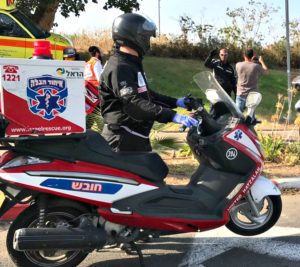 (Photo: Rachamim with his ambucycle responding to a call in Bat Yam. Credit: United Hatzalah)