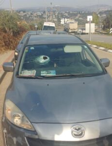 The cars windshield following the rock throwing incident 231x300 1