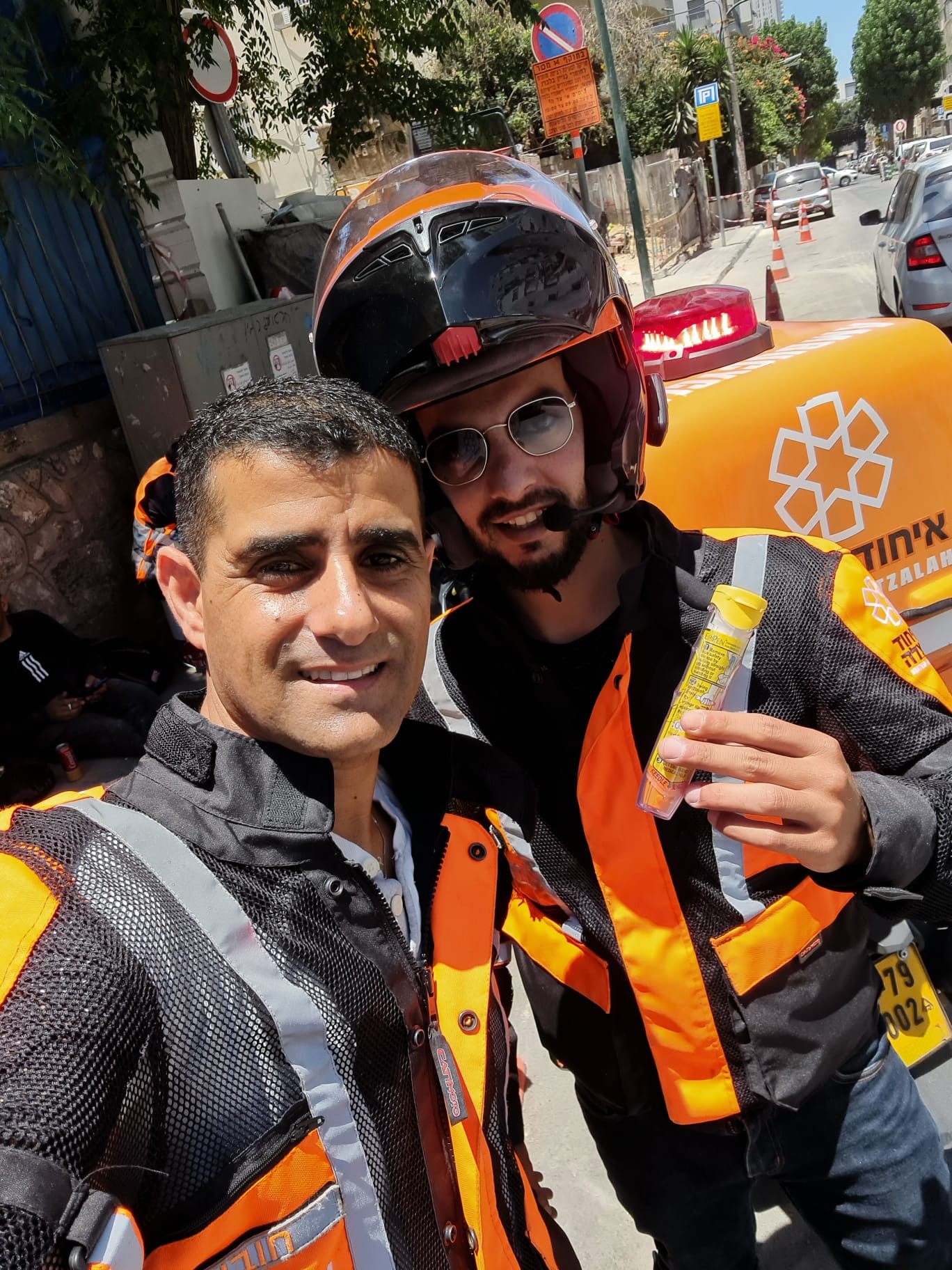 United Hatzalah EMTs holding an Epipen after treating a person suffering from anaphylactic shock Illustration