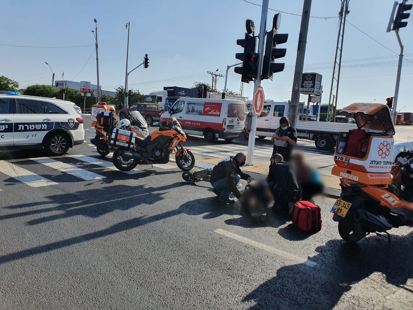 United Hatzalah volunteers treating a seriously injured man after a scooter accident in Ashdod illustration