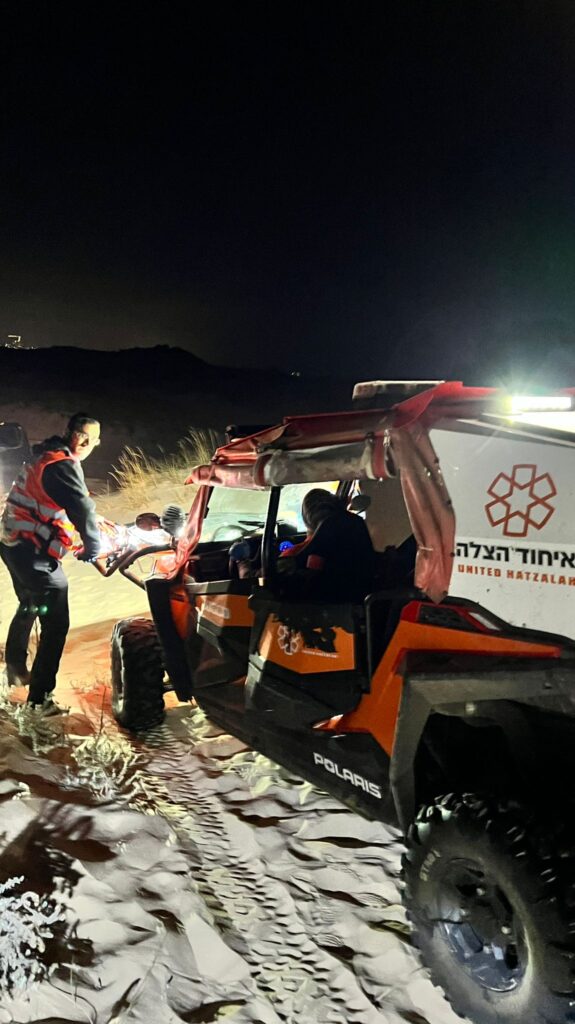 Volunteers transporting the patient 575x1024 1