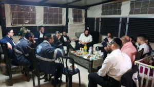 Members of the United Hatzalah Psychotrauma Unit provide support for EMS personnel at group debrief on Saturday night. Credit: Davidi Overlander/United Hatzalah