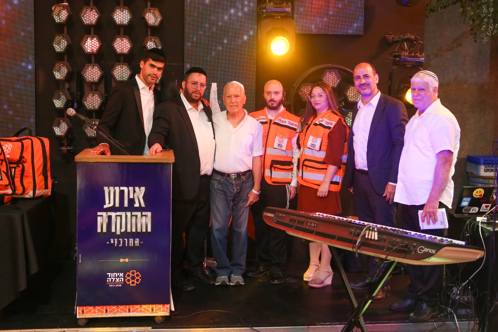 Yitzchak Mizrachi third from left standing in between his rescuers Naftali Rotenberg and Gitti and Avraham Berman