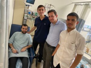 from left to right Shmuel Vaknin Chemi Trachtenberg and his friends in Shmuels hospital room